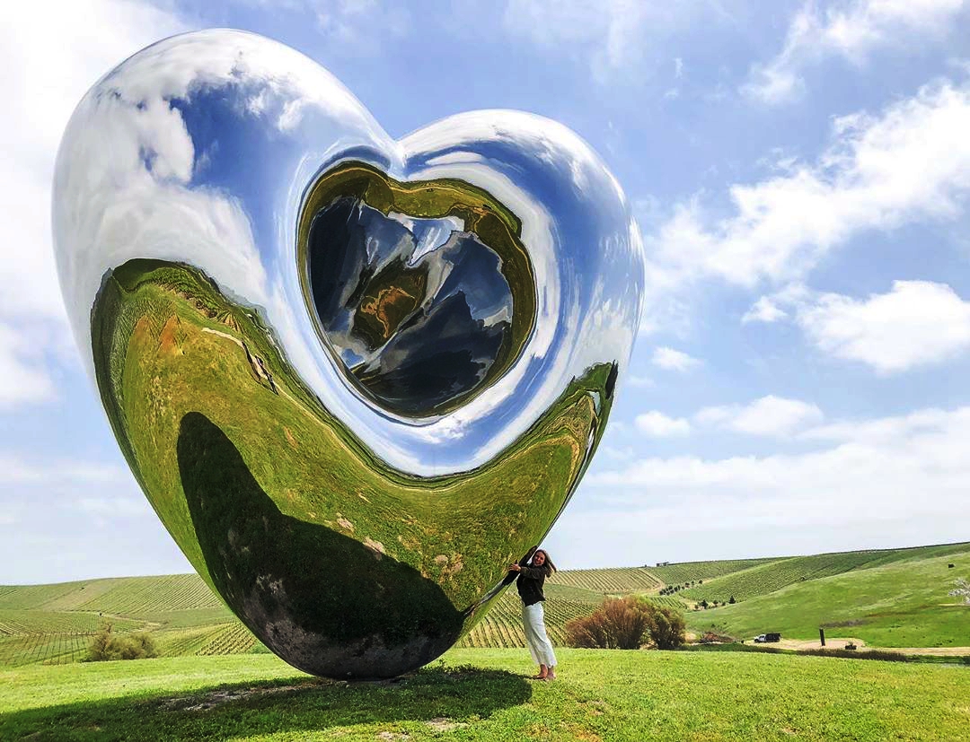 Large Mirror Polished Steel Sculpture Love Me from UK sculptor Mr. Richard Hiudson, 8meters high, in Ca, USA